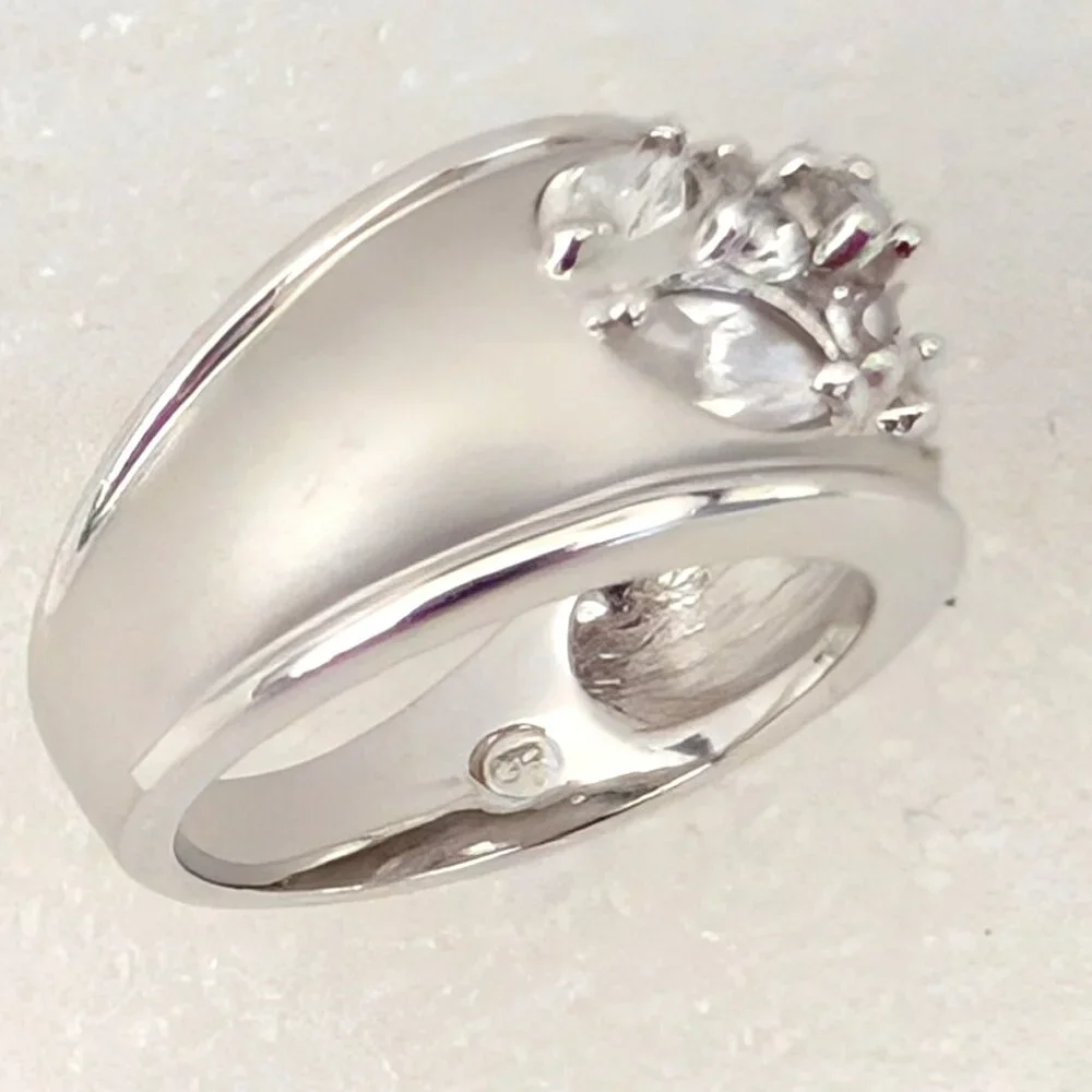 Matte brushed silver tone and faux diamond wide band ring